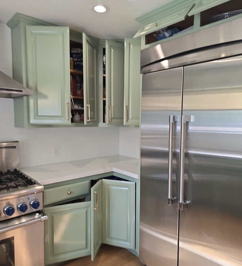 Vivid kitchen cabinet painting in light green by AAF Painting Inc, showcasing professional cabinet refinishing and painting services for a modern, stylish kitchen upgrade.